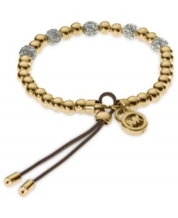 Add a little heat to your look. Michael Kors' stretchable bracelet combines gold tone beads with pave crystal fireballs. Crafted in gold tone mixed metal with an adjustable leather cord. Approximate diameter: 2-1/4 inches. Approximate width: 1/8 inch. Add a little heat to your look. Michael Kors' stretchable bracelet combines gold tone beads with pave crystal fireballs. Crafted in gold tone mixed metal with an adjustable leather cord. Approximate diameter: 2-1/4 inches. Approximate width: 1/8 inch.