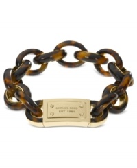 Kick it into neutral with this chic link bracelet from Michael Kors! Crafted in gold tone steel and tortoise acetate, features a large logo-engraved closure. Approximate length: 8-1/2 inches. Kick it into neutral with this chic link bracelet from Michael Kors! Crafted in gold tone steel and tortoise acetate, features a large logo-engraved closure. Approximate length: 8-1/2 inches.