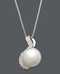 You will be absolutely enamored with the timeless elegance of a simple pearl. A cultured South Sea pearl (13-14 mm) suspended from a 14k white gold setting and chain is highlighted by sparkling round-cut diamonds (1/3 ct. t.w.). Approximate length: 18 inches. Approximate drop: 1 inch. You will be absolutely enamored with the timeless elegance of a simple pearl. A cultured South Sea pearl (13-14 mm) suspended from a 14k white gold setting and chain is highlighted by sparkling round-cut diamonds (1/3 ct. t.w.). Approximate length: 18 inches. Approximate drop: 1 inch.