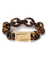 Michael Kors blends heritage-inspired design with rich materials to eye-catching effect. This link bracelet is finished in tortoise shell for a cool, retro touch.