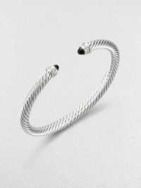 From the Cable Classics Collection. A twisted cable of sterling silver capped with faceted stones of dramatic black onyx and ringed with pavé diamonds.Diamonds, .09 tcwBlack onyxSterling silverCable width, 5mmDiameter, about 2Made in USA From the Cable Classics Collection. A twisted cable of sterling silver capped with faceted stones of dramatic black onyx and ringed with pavé diamonds.Diamonds, .09 tcwBlack onyxSterling silverCable width, 5mmDiameter, about 2Made in USA