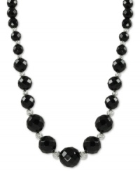 Beautiful in black. Rich onyx (6-12 mm) stands out on this sterling silver necklace with rhodium-plated sparkle beads adding a lustrous touch. Approximate length: 18 inches. Beautiful in black. Rich onyx (6-12 mm) stands out on this sterling silver necklace with rhodium-plated sparkle beads adding a lustrous touch. Approximate length: 18 inches.