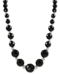 Beautiful in black. Rich onyx (6-12 mm) stands out on this sterling silver necklace with rhodium-plated sparkle beads adding a lustrous touch. Approximate length: 18 inches.