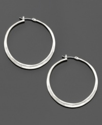 Textured for a subtly rustic finish, these mixed metal silvertone hoop earrings are a modern must-have. Each measures 1-1/2 inches in diameter. Textured for a subtly rustic finish, these mixed metal silvertone hoop earrings are a modern must-have. Each measures 1-1/2 inches in diameter.