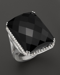 Faceted onyx is trimmed in white topaz on a timeless Badgley Mischka ring. Faceted onyx is trimmed in white topaz on a timeless Badgley Mischka ring.