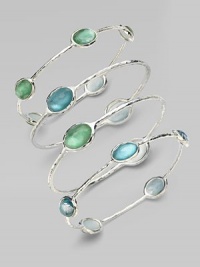 From the Silver Wonderland Collection. Faceted ovals of quartz in soft denim blue are backed by discs of mother-of-pearl and set in a graceful bangle of hammered sterling silver. Quartz and mother-of-pearl Sterling silver Diameter, about 2¾ ImportedPlease note: Bracelets sold separately. From the Silver Wonderland Collection. Faceted ovals of quartz in soft denim blue are backed by discs of mother-of-pearl and set in a graceful bangle of hammered sterling silver. Quartz and mother-of-pearl Sterling silver Diameter, about 2¾ ImportedPlease note: Bracelets sold separately.