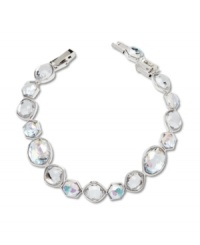 No matter what the occasion, add sparkle to your look with Swarovski's glimmering rhinestone bracelet. Made in silver tone mixed metal, it features an array of asymmetrical crystals. Approximate length: 7 inches. No matter what the occasion, add sparkle to your look with Swarovski's glimmering rhinestone bracelet. Made in silver tone mixed metal, it features an array of asymmetrical crystals. Approximate length: 7 inches.