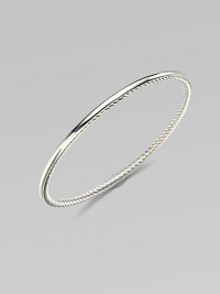 From the Bangle Collection. A single bangle of sterling silver, smooth on the outside and cabled on the inside, to wear alone or with others. Sterling silver Width, about ¼ Diameter, about 2½ Imported From the Bangle Collection. A single bangle of sterling silver, smooth on the outside and cabled on the inside, to wear alone or with others. Sterling silver Width, about ¼ Diameter, about 2½ Imported