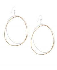 Decorate yourself with luxurious loops. Two-tone hoop earrings by Jessica Simpson feature a chic modern design crafted in gold and silver tone mixed metal. Approximate drop: 3 inches.