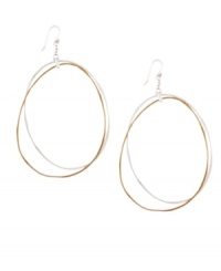 Decorate yourself with luxurious loops. Two-tone hoop earrings by Jessica Simpson feature a chic modern design crafted in gold and silver tone mixed metal. Approximate drop: 3 inches. Decorate yourself with luxurious loops. Two-tone hoop earrings by Jessica Simpson feature a chic modern design crafted in gold and silver tone mixed metal. Approximate drop: 3 inches.