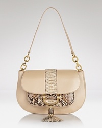Adopt an exotic approach to accessorizing with this shoulder bag from Michael Kors. A classic design and rich python accents make this style an ever-chic investment. Adopt an exotic approach to accessorizing with this shoulder bag from Michael Kors. A classic design and rich python accents make this style an ever-chic investment.