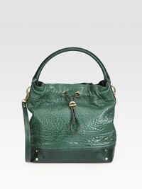 Textured leather in a slouchy drawstring design. Available in green leather with gold hardware or black leather with silver hardware. Top handle, 7 dropDetachable shoulder strap, 17 dropMagnetic snap closure with drawstringProtective metal feetOne inside zip pocketTwo inside open pocketsSatin lining12W X 12H X 4¾DImported Textured leather in a slouchy drawstring design. Available in green leather with gold hardware or black leather with silver hardware. Top handle, 7 dropDetachable shoulder strap, 17 dropMagnetic snap closure with drawstringProtective metal feetOne inside zip pocketTwo inside open pocketsSatin lining12W X 12H X 4¾DImported