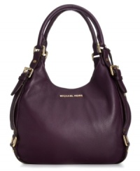 Elegant and on-trend, this take-anywhere shoulder tote from MICHAEL Michael Kors is the accessory of the season. Soft leather is adorned with golden buckle and stud accents, while the roomy interior provides three separate compartments to keep you organized on-the-go. Elegant and on-trend, this take-anywhere shoulder tote from MICHAEL Michael Kors is the accessory of the season. Soft leather is adorned with golden buckle and stud accents, while the roomy interior provides three separate compartments to keep you organized on-the-go.