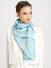 A subtle tonal, logo pattern design with a sweet, baby fringe.50% silk/50% cottonAbout 28 X 80Dry cleanImported A subtle tonal, logo pattern design with a sweet, baby fringe.50% silk/50% cottonAbout 28 X 80Dry cleanImported