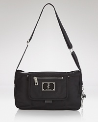 Glamor-girl brand Juicy Couture takes a practical approach to accessorizing with this nylon satchel. Packed with pockets and ideally sized for days on the go, it perfects effortless style. Glamor-girl brand Juicy Couture takes a practical approach to accessorizing with this nylon satchel. Packed with pockets and ideally sized for days on the go, it perfects effortless style.