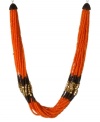 Your daily dose of orange. Kenneth Cole New York's chic torsade necklace combines a colorful mix of orange seed beads with brown seed beads and gold tone square accents. Set in silver tone mixed metal. Approximate length: 17 inches + 3-inch extender. Approximate drop: 1/2 inch.