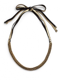 THE LOOKAntique-inspired brass chainDouble ribbon tie closure with gold foil suede detailTHE FITAbout 16 long7MM grosgrain tieTHE MATERIAL50% brass/25% leather/25% viscose rayonORIGINMade in USA THE LOOKAntique-inspired brass chainDouble ribbon tie closure with gold foil suede detailTHE FITAbout 16 long7MM grosgrain tieTHE MATERIAL50% brass/25% leather/25% viscose rayonORIGINMade in USA
