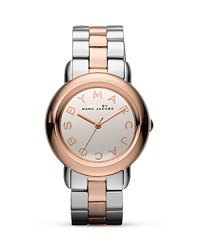 Clock in with MARC BY MARC JACOBS. This duo-tone plated metal watch flaunts an ever-chic design with the brand's enviable stamp. Clock in with MARC BY MARC JACOBS. This duo-tone plated metal watch flaunts an ever-chic design with the brand's enviable stamp.