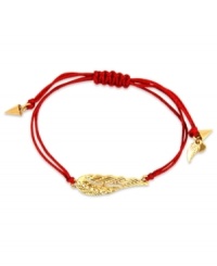 Let your look take flight. This RACHEL Rachel Roy bracelet showcases a wing charm with glass stone accents. An adjustable red waxed cotton cord holds it all together. Set in worn gold tone mixed metal. Approximate diameter: 1 inch. Adjustable from 1 inch to 7-1/4 inches. Let your look take flight. This RACHEL Rachel Roy bracelet showcases a wing charm with glass stone accents. An adjustable red waxed cotton cord holds it all together. Set in worn gold tone mixed metal. Approximate diameter: 1 inch. Adjustable from 1 inch to 7-1/4 inches.