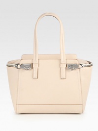An elegant style with edgy zippers in beautiful pebbled leather; perfect for all your essentials.Double top handles, 8 dropTop zip closureTwo outside zip pockets with flip-lock zip pullsOne inside zip pocketTwo inside open pocketsSuede lining11¼W X 9½H X 6¼DImported An elegant style with edgy zippers in beautiful pebbled leather; perfect for all your essentials.Double top handles, 8 dropTop zip closureTwo outside zip pockets with flip-lock zip pullsOne inside zip pocketTwo inside open pocketsSuede lining11¼W X 9½H X 6¼DImported