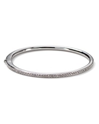 The slender bangle from Nadri is crafted in polished rhodium plate with a single-row of gleaming crystal pave to a bring a touch of light. The slender bangle from Nadri is crafted in polished rhodium plate with a single-row of gleaming crystal pave to a bring a touch of light.