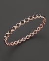 Smokey quartz stations dot a polished rosegold bangle from Ippolita.