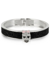 A look to die for. Betsey Johnson's hinged bangle bracelet features black glitter details and glass crystal accents in the form of a spruced-up skull for a fun effect. Approximate diameter: 2-1/4 inches. A look to die for. Betsey Johnson's hinged bangle bracelet features black glitter details and glass crystal accents in the form of a spruced-up skull for a fun effect. Approximate diameter: 2-1/4 inches.