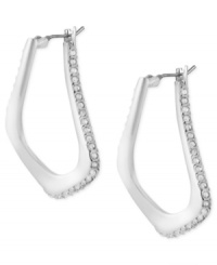 Abstract elegance. This pair of oval hoop earrings from Robert Lee Morris is crafted from silver-tone mixed metal with glass pave crystal accents providing a lustrous touch. The sculptural shape enhances the appeal. Approximate drop: 1-1/4 inches. Approximate diameter: 1/2 inch. Abstract elegance. This pair of oval hoop earrings from Robert Lee Morris is crafted from silver-tone mixed metal with glass pave crystal accents providing a lustrous touch. The sculptural shape enhances the appeal. Approximate drop: 1-1/4 inches. Approximate diameter: 1/2 inch.