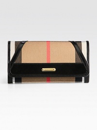 Iconic check-print denim accented with smooth leather and a signature plaque.Snap button flap closureOne outside open pocketOpen compartments on and under flapOne inside zip pocketTwelve credit card slotsFour open compartmentsFully lined7½W X 4H X 1DMade in Italy Iconic check-print denim accented with smooth leather and a signature plaque.Snap button flap closureOne outside open pocketOpen compartments on and under flapOne inside zip pocketTwelve credit card slotsFour open compartmentsFully lined7½W X 4H X 1DMade in Italy