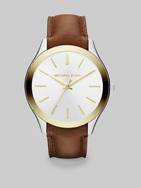 Elegant and understated, in stainless steel with goldtone accents, a sleek dial and a rich luggage leather strap.Quartz movementWater resistant to 10 ATMStainless steel and goldtone round case, 38mm diameter (1.5)Polished bezelLight champagne dialGoldtone bar hour markersSecond handLeather strapImported Elegant and understated, in stainless steel with goldtone accents, a sleek dial and a rich luggage leather strap.Quartz movementWater resistant to 10 ATMStainless steel and goldtone round case, 38mm diameter (1.5)Polished bezelLight champagne dialGoldtone bar hour markersSecond handLeather strapImported