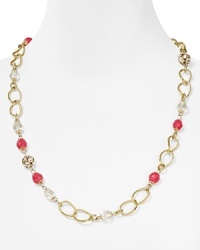 Milly's ethereal arrangement of beads and pink rhinestone fireballs on chain link. Milly's ethereal arrangement of beads and pink rhinestone fireballs on chain link.