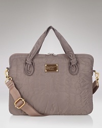 Neat knots, a sling-over-your-shoulder strap, and tough-luxe nylon let your computer travel in style. Inside, faux fur adds a dimension of witty elegance. From Marc by Marc Jacobs Neat knots, a sling-over-your-shoulder strap, and tough-luxe nylon let your computer travel in style. Inside, faux fur adds a dimension of witty elegance. From Marc by Marc Jacobs