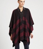 Signature check pattern is printed on sumptuous cashmere in a cape silhouette.Cashmere66 X 47Open frontDry cleanImported