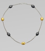 Beautifully textured stations in two-tone sterling silver and radiant 24k gold on a sterling silver link chain. Two-tone sterling silver24k goldLength, about 16 to 18 adjustableLobster clasp closureImported 