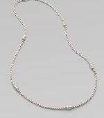 A intricately woven piece accented periodically with oblong station beads. Sterling silver Length, about 24 Imported 