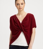 This v-neck, twist-front cashmere topper is perfect for snuggling luxuriously.CashmereShort sleevesPullover styleHand wash or dry cleanImported