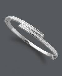 Sparkling sophistication. This subtly shimmering style features a unique bypass design accented by round-cut diamonds. Set in sterling silver with a slip-on hinge clasp. Approximate length: 7 inches. Sparkling sophistication. This subtly shimmering style features a unique bypass design accented by round-cut diamonds. Set in sterling silver with a slip-on hinge clasp. Approximate length: 7 inches.