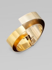 This goldtone frame design features an asymmetrical hinged closure. BrassDiameter, about 2Hinged closureMade in Italy This goldtone frame design features an asymmetrical hinged closure. BrassDiameter, about 2Hinged closureMade in Italy