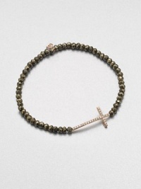 A delicate diamond accented 14k rose gold cross on a stunning pyrite beaded stretch bracelet. Diamonds, .14 tcw14k rose goldPyriteDiameter, about 2.5Slip-on styleImported A delicate diamond accented 14k rose gold cross on a stunning pyrite beaded stretch bracelet. Diamonds, .14 tcw14k rose goldPyriteDiameter, about 2.5Slip-on styleImported