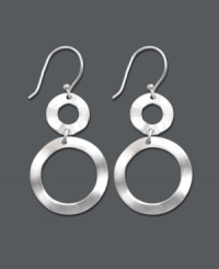 Simple shapes make a sublime statement in these pretty dangle earrings by Studio Silver. Two cut-out, graduated circles shine in polished sterling silver. Approximate drop: 1-1/2 inches. Simple shapes make a sublime statement in these pretty dangle earrings by Studio Silver. Two cut-out, graduated circles shine in polished sterling silver. Approximate drop: 1-1/2 inches.