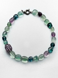 A colorful strand of flourite beads accented with a amethyst encrusted bead. AmethystMulti-colored flouriteRhodium-plated sterling silverLength, about 18Spring ring closureImported 