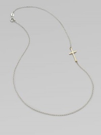 A simple, sleek cross of 14k gold sits sideways within a delicate sterling silver chain in this eloquent design.14k yellow gold and sterling silverLength, about 18Spring ring claspMade in USA A simple, sleek cross of 14k gold sits sideways within a delicate sterling silver chain in this eloquent design.14k yellow gold and sterling silverLength, about 18Spring ring claspMade in USA