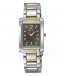 As indispensable as a pair of pearl earrings, this Seiko watch is the classic everyday watch. Two-tone stainless steel bracelet and rectangular case. Charcoal dial with striped inner dial features goldtone numeral at twelve o'clock, stick indices, two hands and logo. Quartz movement. Water resistant to 30 meters. Three-year limited warranty. As indispensable as a pair of pearl earrings, this Seiko watch is the classic everyday watch. Two-tone stainless steel bracelet and rectangular case. Charcoal dial with striped inner dial features goldtone numeral at twelve o'clock, stick indices, two hands and logo. Quartz movement. Water resistant to 30 meters. Three-year limited warranty.