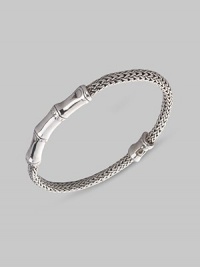 From the Bamboo Collection. A woven rope of sterling silver, accented by graceful bamboo-patterned stations. This Limited Edition design was expressly created to support an afforestation project on Nusa Penida, an arid island off the coast of Bali. For every purchase, John Hardy will donate 10% of the retail price to the cost of planting bamboo. This bracelet helped plant 5 bamboo seedlings. Sterling silver Length, about 7½ Push-lock clasp Made in Bali From the Bamboo Collection. A woven rope of sterling silver, accented by graceful bamboo-patterned stations. This Limited Edition design was expressly created to support an afforestation project on Nusa Penida, an arid island off the coast of Bali. For every purchase, John Hardy will donate 10% of the retail price to the cost of planting bamboo. This bracelet helped plant 5 bamboo seedlings. Sterling silver Length, about 7½ Push-lock clasp Made in Bali