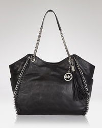 For the woman who refuses to sacrifice fashion in the name of function, this MICHAEL Michael Kors tote works on both fronts, crafted of rich leather. For the woman who refuses to sacrifice fashion in the name of function, this MICHAEL Michael Kors tote works on both fronts, crafted of rich leather.