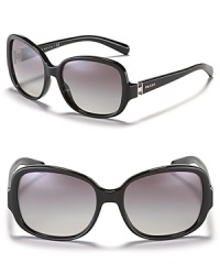 Sophisticated oblong oversized sunglasses with signature logo plate at temples from Prada. Sophisticated oblong oversized sunglasses with signature logo plate at temples from Prada.