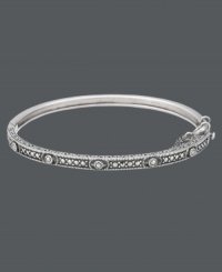 Add a slice of style with this thin, slip of a bangle. Genevieve & Grace's design highlights an intricate pattern that shines with the addition of glittering marcasite accents. Crafted in sterling silver. Approximate diameter: 2-1/2 inches. Add a slice of style with this thin, slip of a bangle. Genevieve & Grace's design highlights an intricate pattern that shines with the addition of glittering marcasite accents. Crafted in sterling silver. Approximate diameter: 2-1/2 inches.