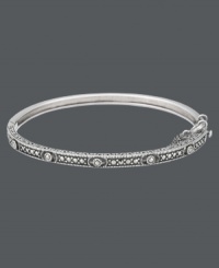 Add a slice of style with this thin, slip of a bangle. Genevieve & Grace's design highlights an intricate pattern that shines with the addition of glittering marcasite accents. Crafted in sterling silver. Approximate diameter: 2-1/2 inches.