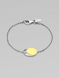 From the Eclipse Collection. A modern update of the classic ID bracelet, offering a slanted oval disk on a graceful chain.Sterling silverGoldplatedLength, about 7Disc length, about ¾Lobster claspImported From the Eclipse Collection. A modern update of the classic ID bracelet, offering a slanted oval disk on a graceful chain.Sterling silverGoldplatedLength, about 7Disc length, about ¾Lobster claspImported