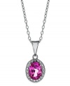 Pretty in pink. Victoria Townsend's polished pendant features an oval-cut pink topaz (1-1/8 ct. t.w.) surrounded by diamond accents. Set in sterling silver. Approximate length: 18 inches. Approximate drop: 3/4 inch.